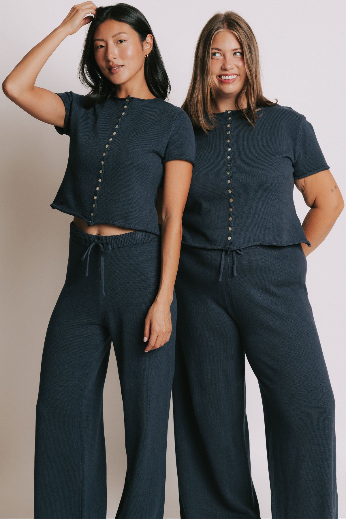 navy short sleeve button down top with rolled edges