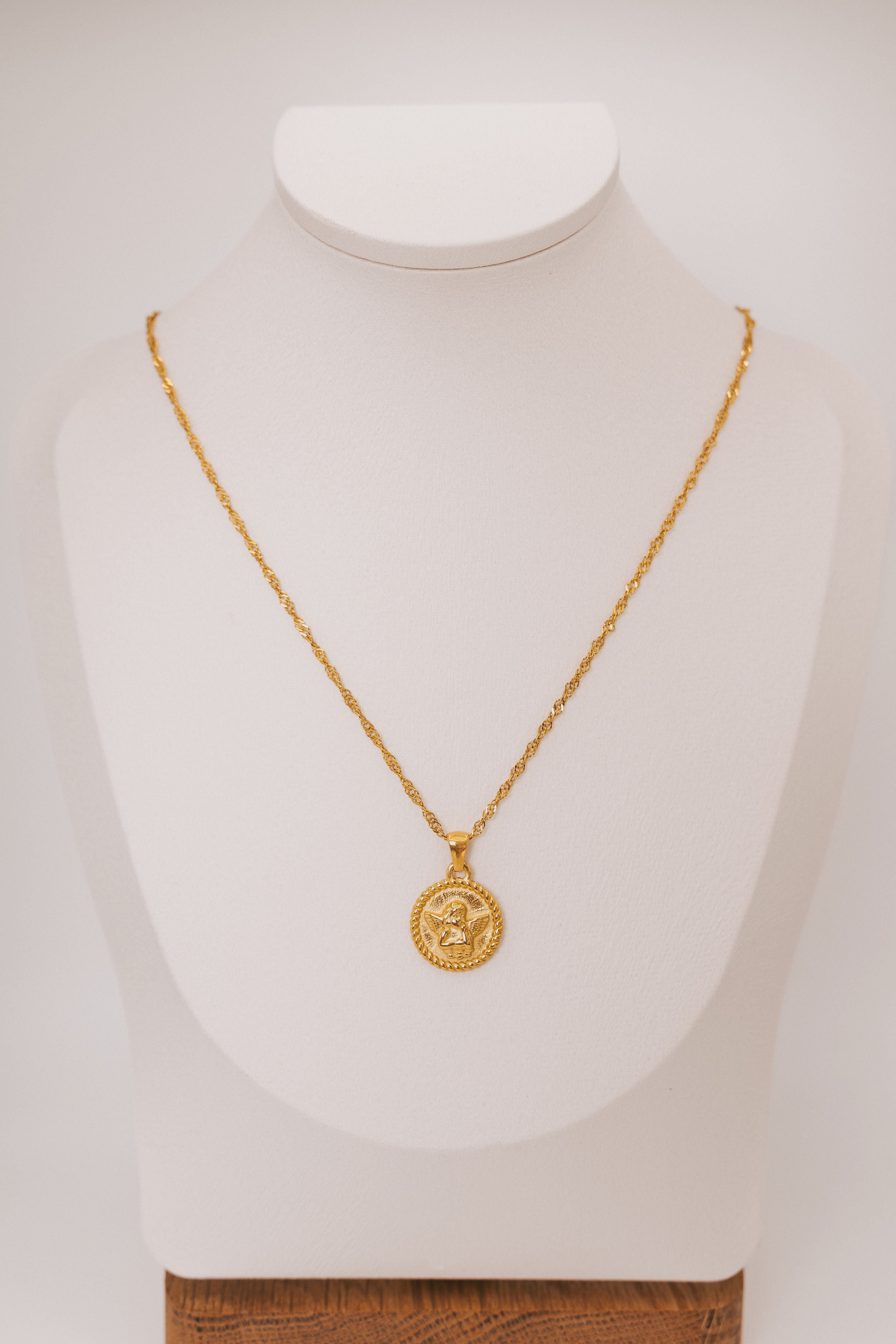 necklace with circular angel pendant
