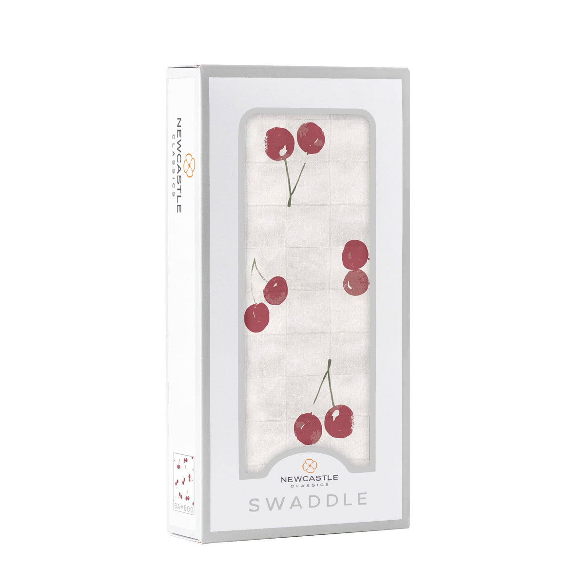 white baby swaddle with cherry pattern by newcastle classics