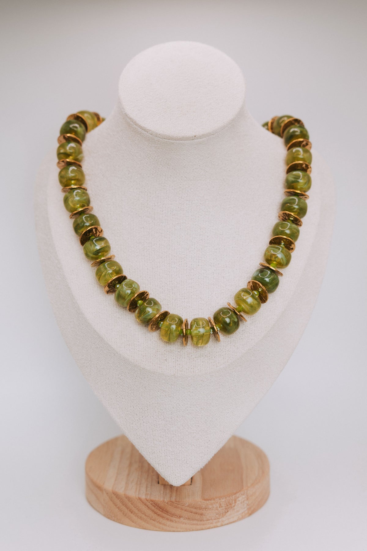 olive marble necklace display