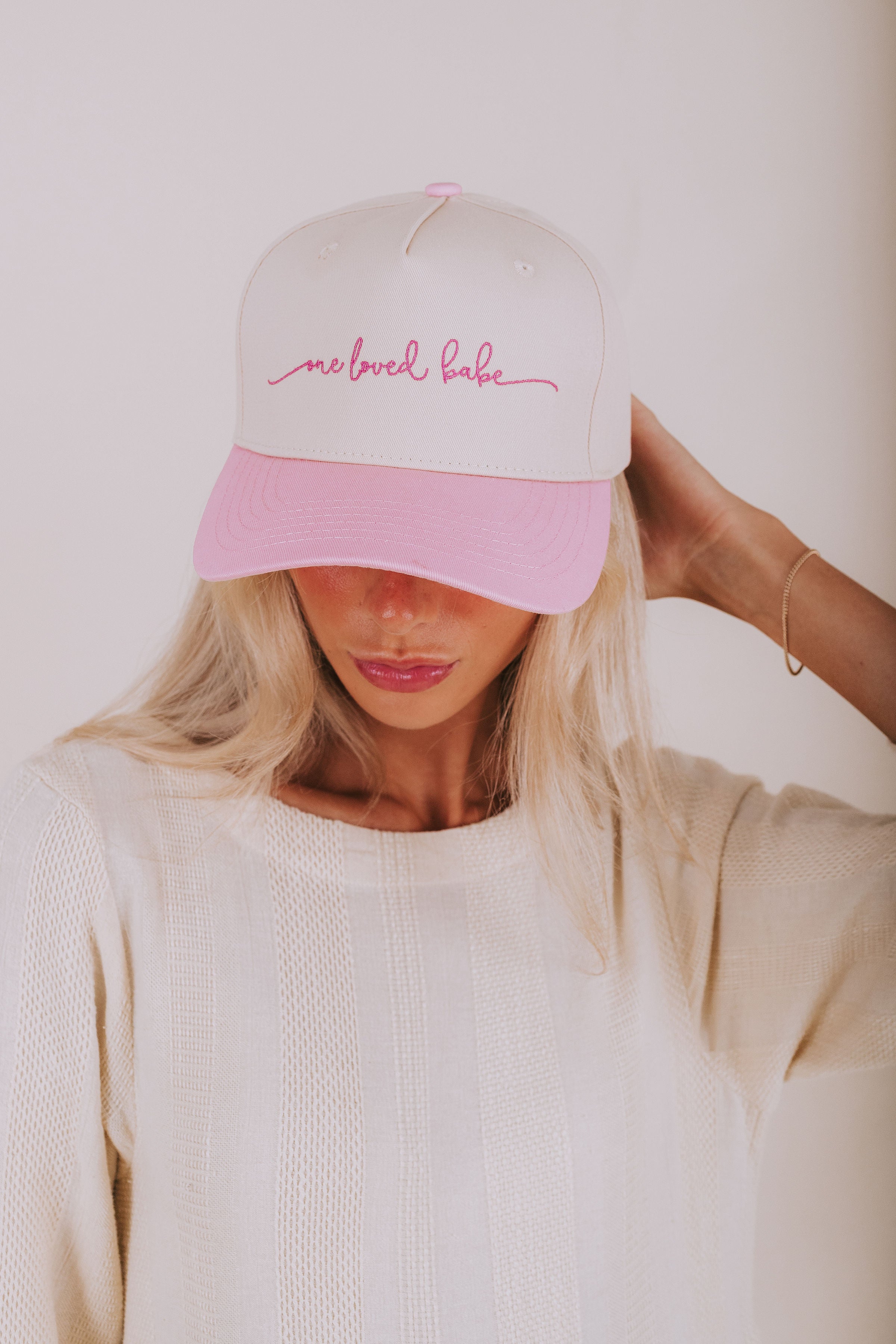 Cream baseball cap with pink visor and one loved babe logo OLB 