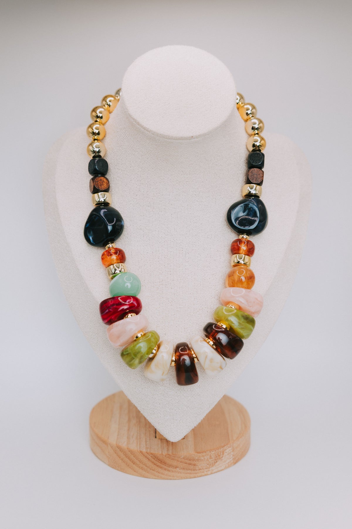 oversized multicolored stone necklace display