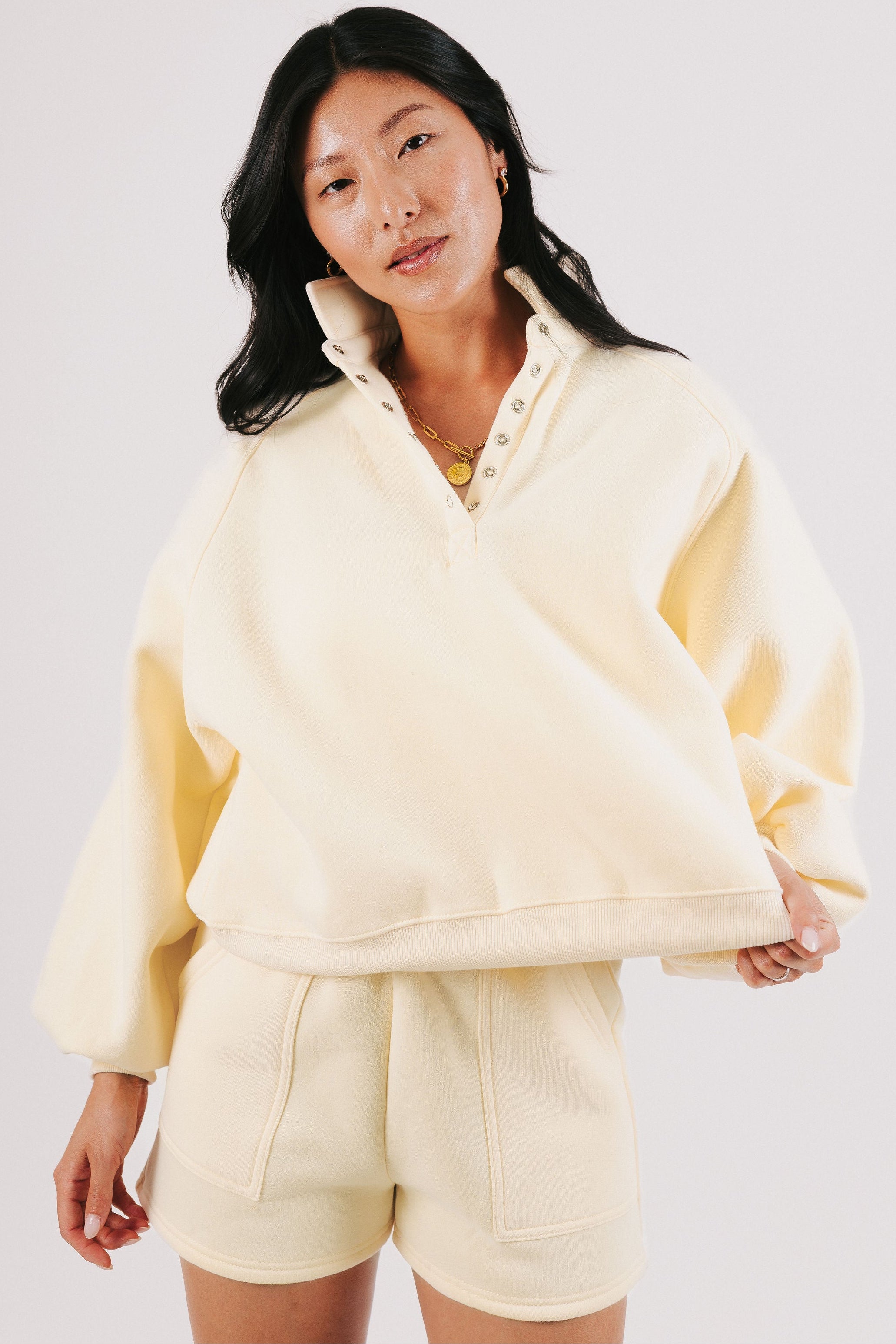 pale yellow partial button down sweatshirt 