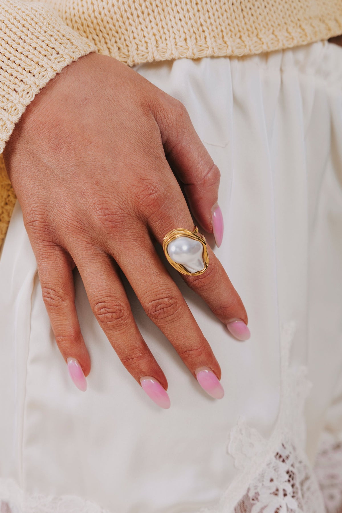 large pearl ring with gold embellishment 