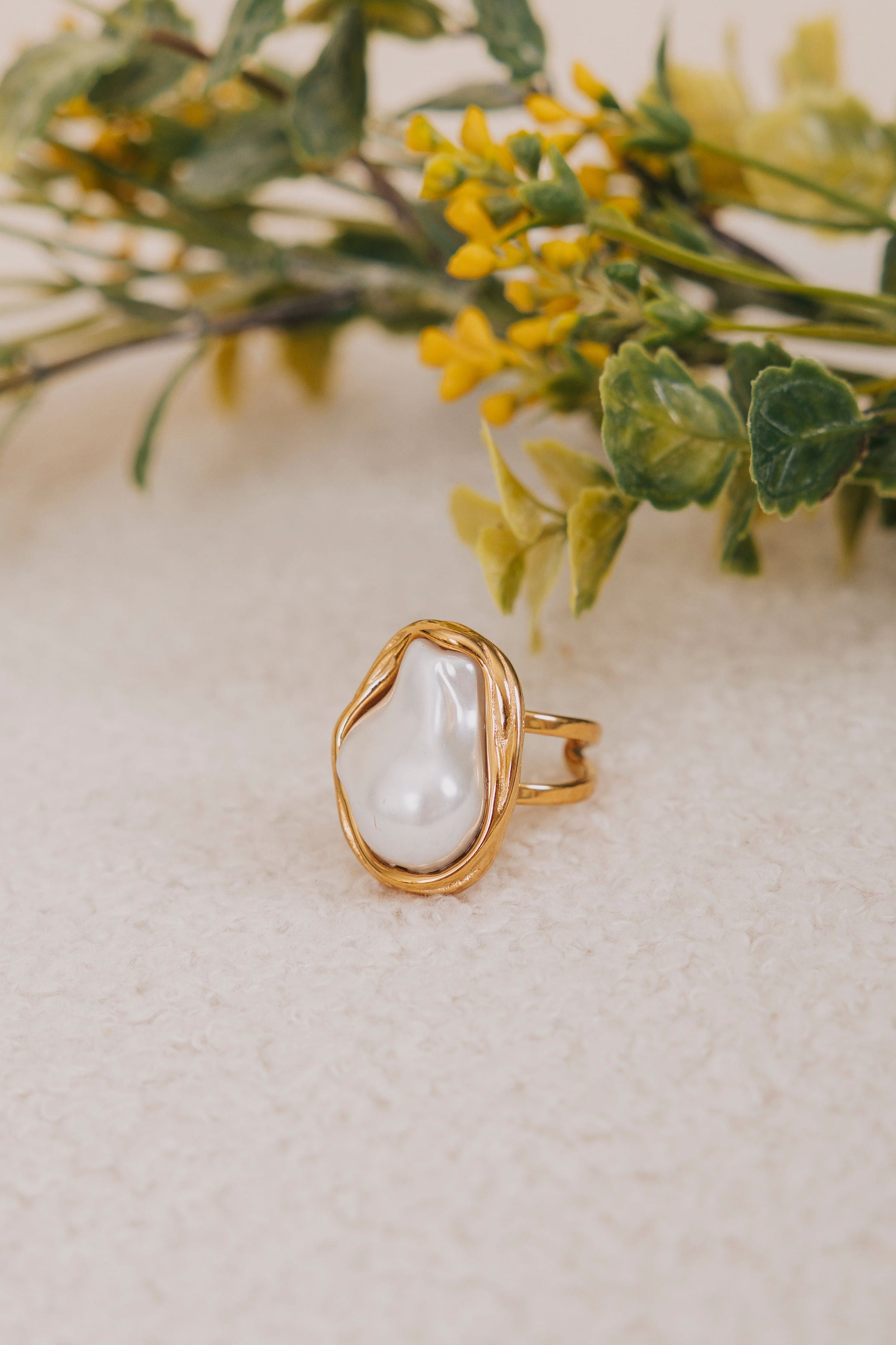 large pearl ring with gold embellishment 