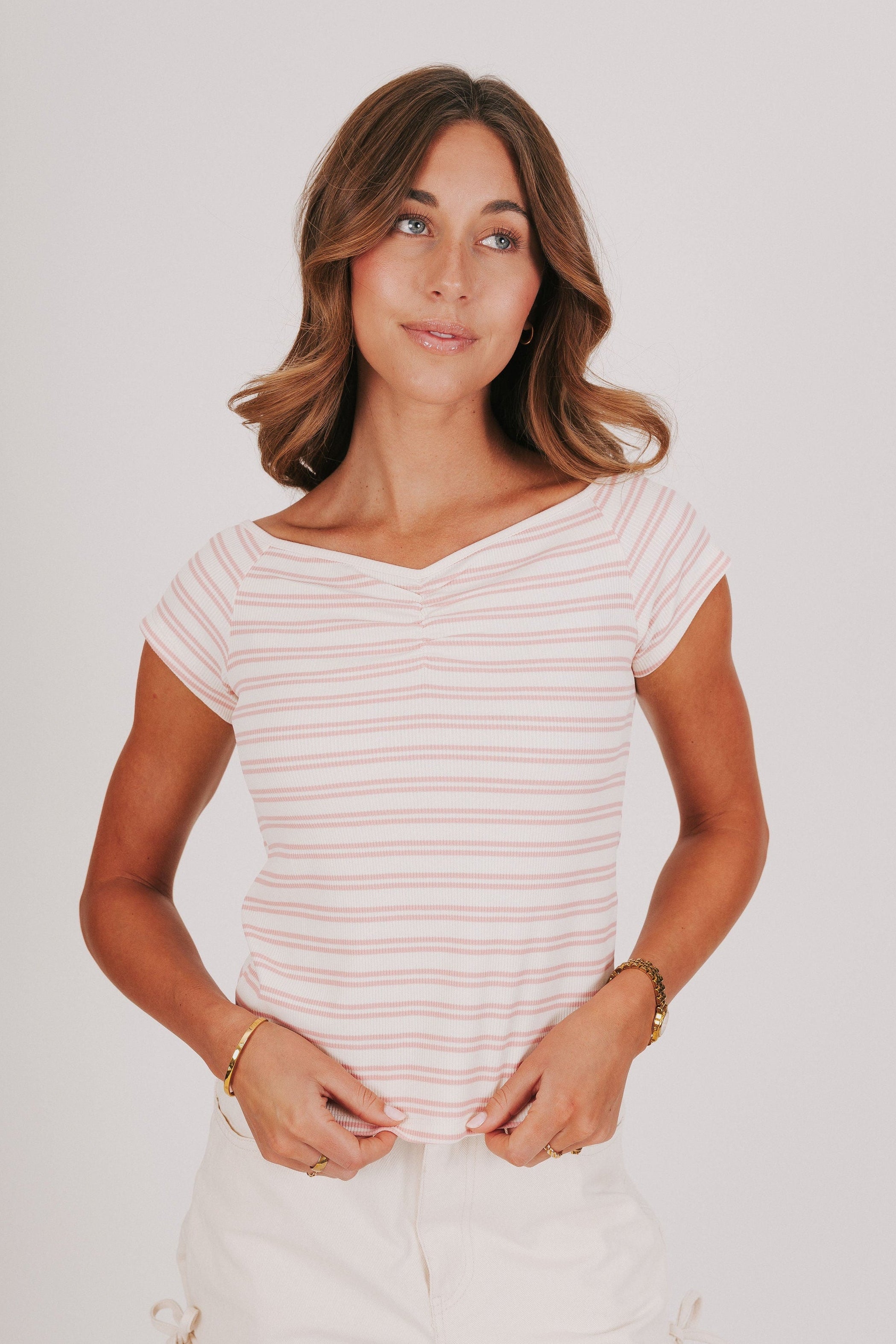 pink and white striped top with wide neck