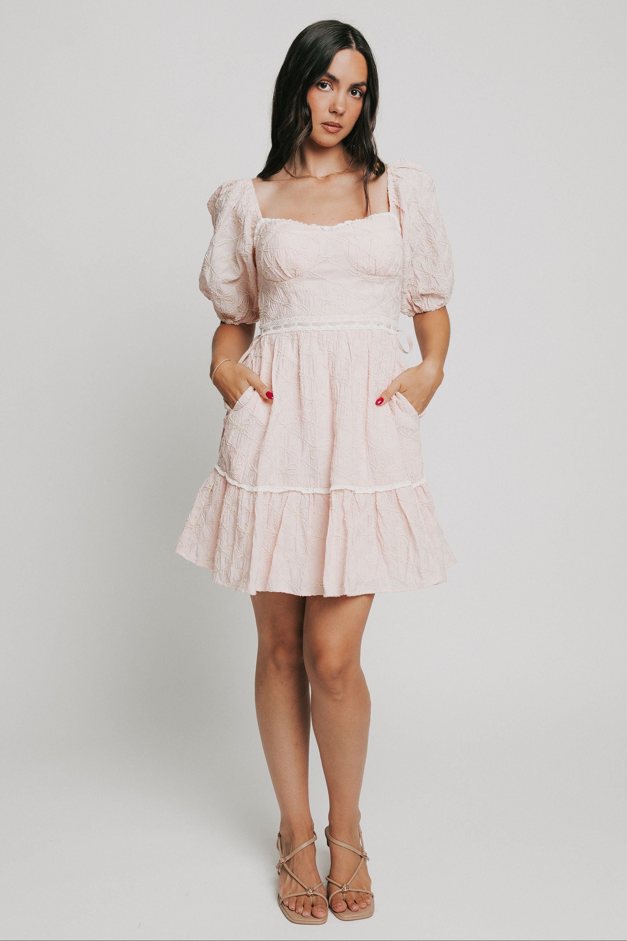 pink bow patterned mini dress with white lace trim