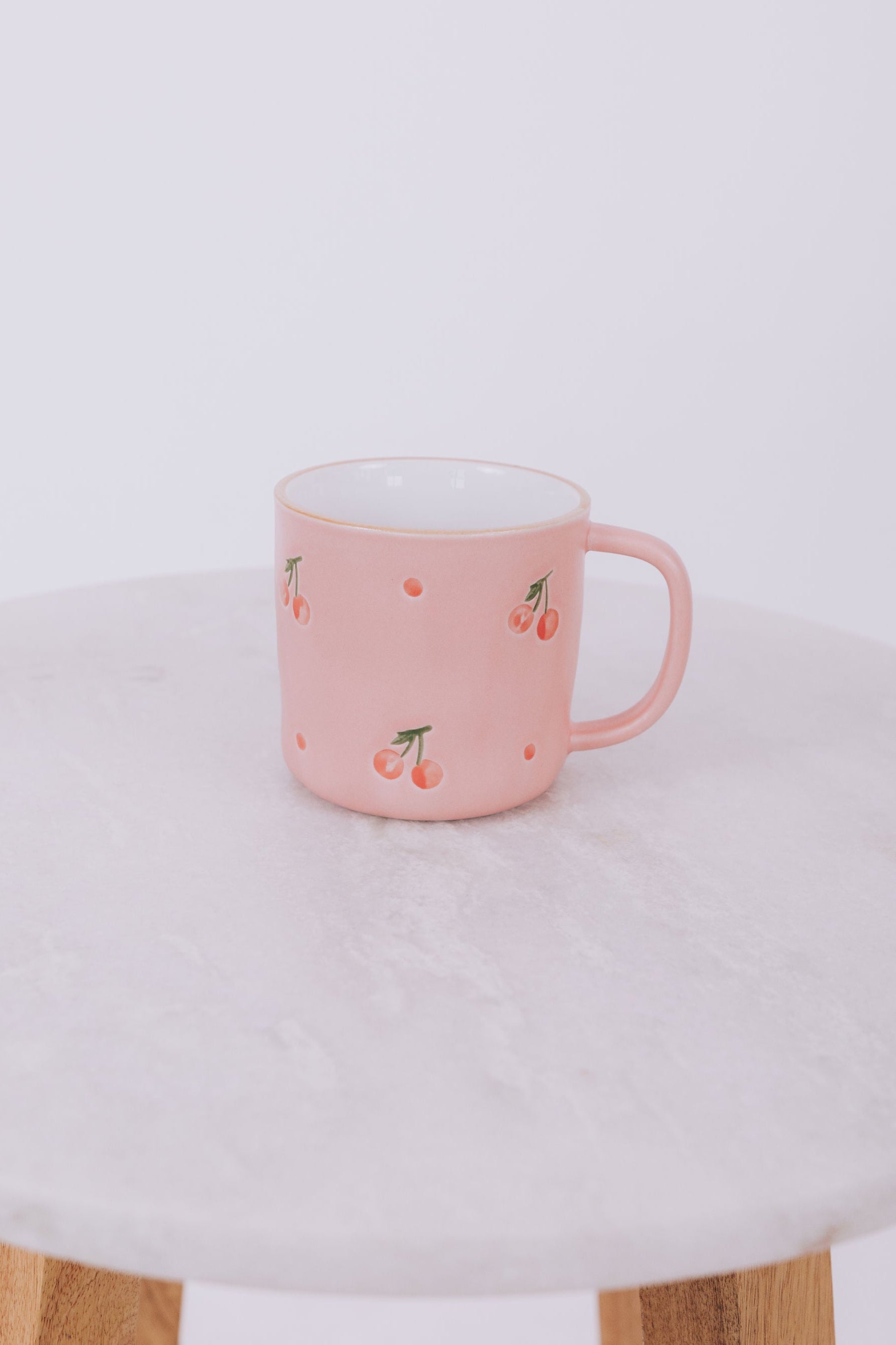 Pink mug with cherry design