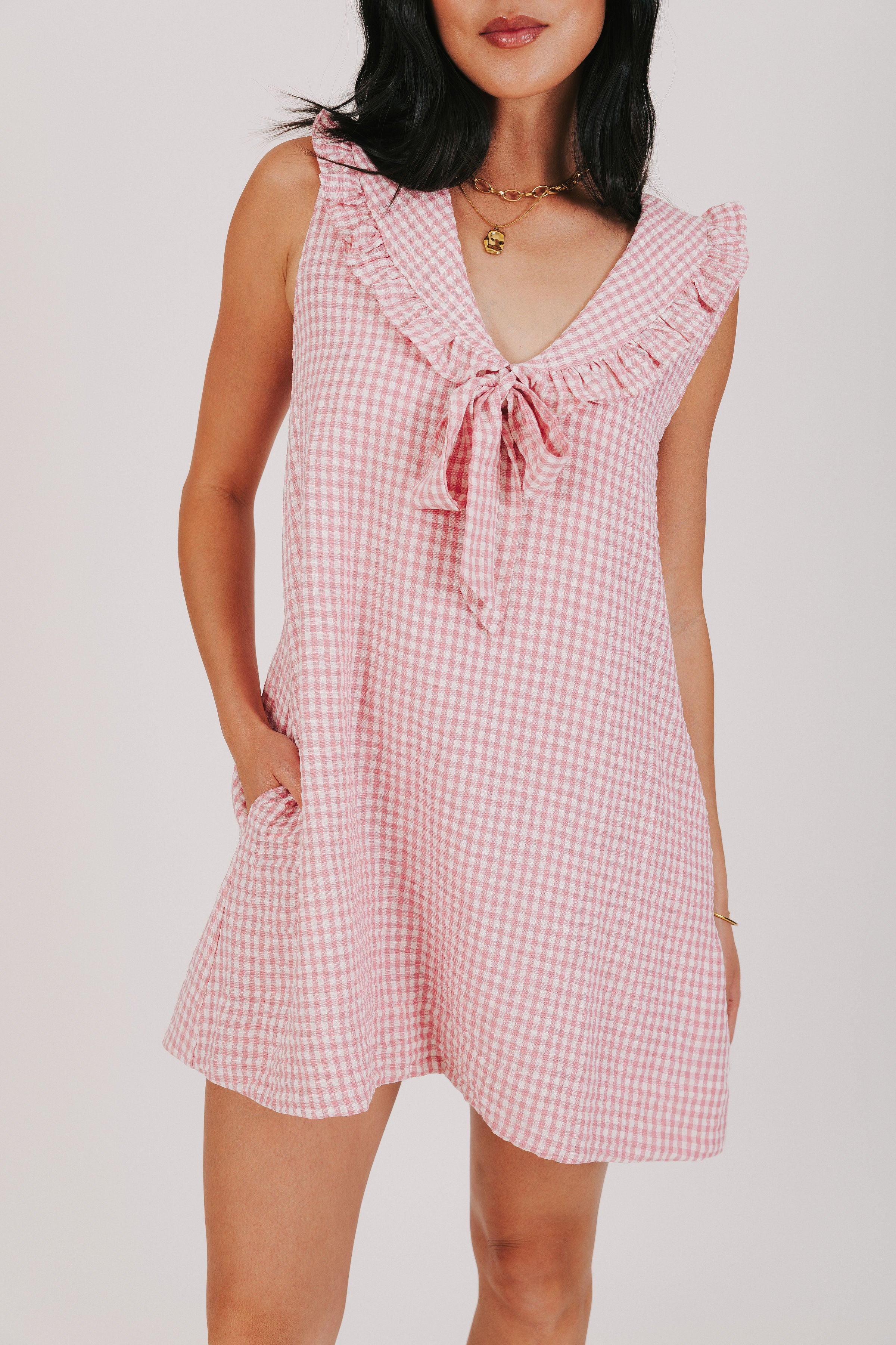 pink gingham sleeveless dress with oversized collar