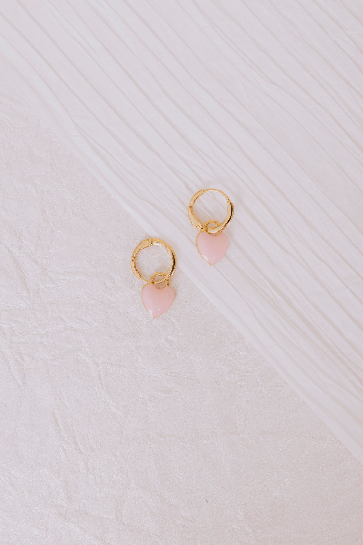 pink puff heart dangle hoop earring flatlay