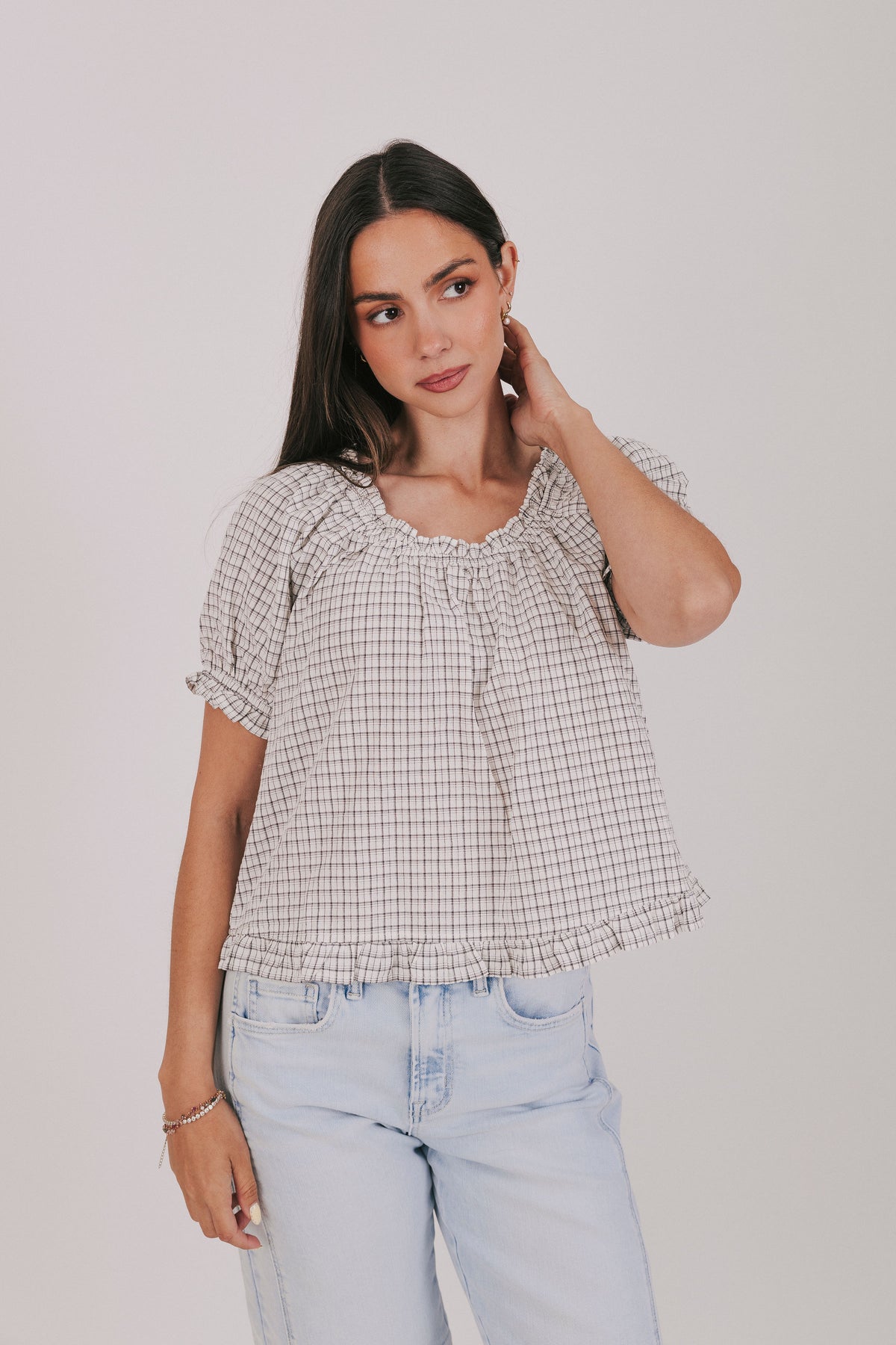 Plaid ruffle trimmed blouse with short puff sleeves and elastic neck