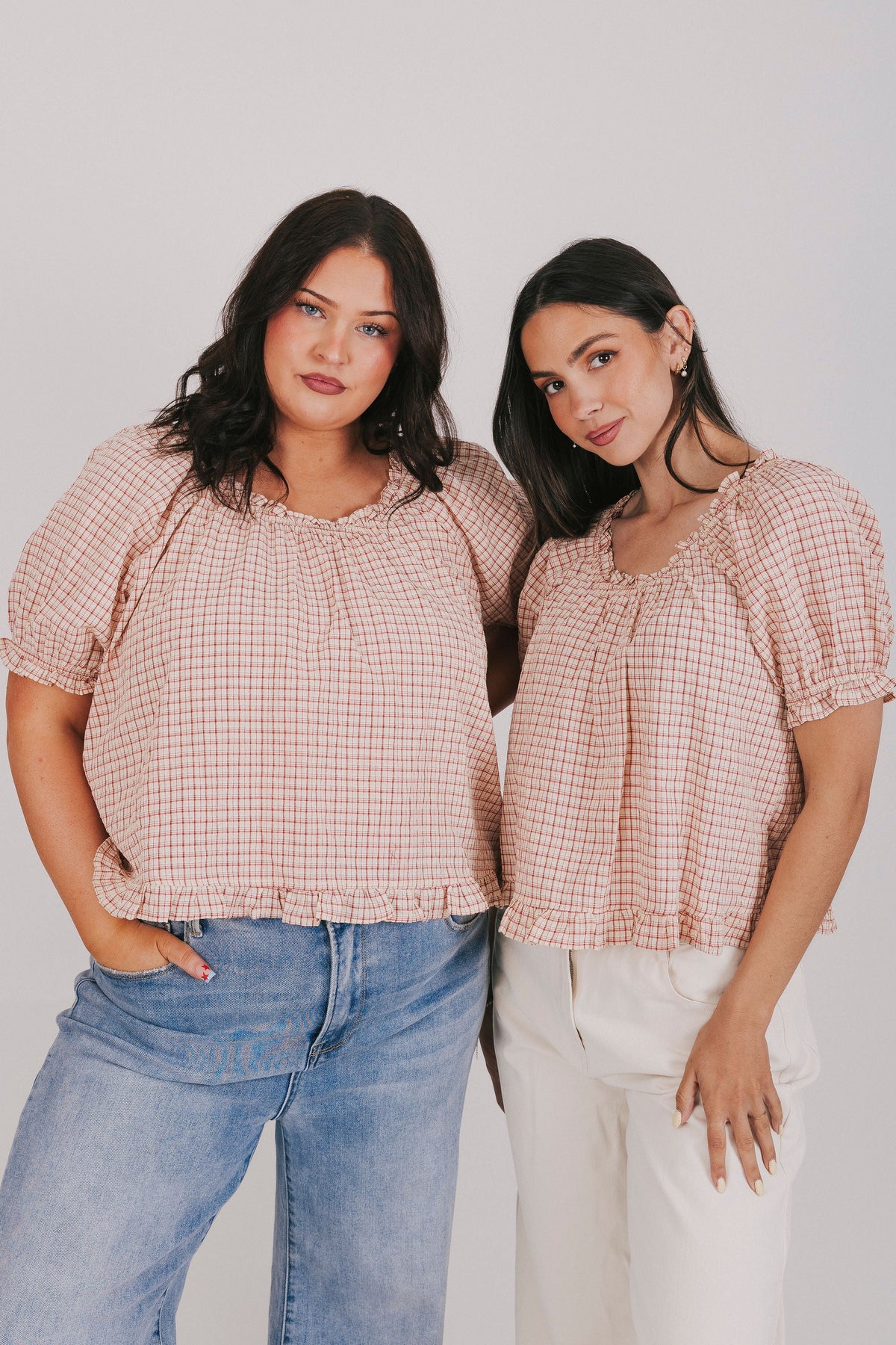 Plaid ruffle trimmed blouse with short puff sleeves and elastic neck