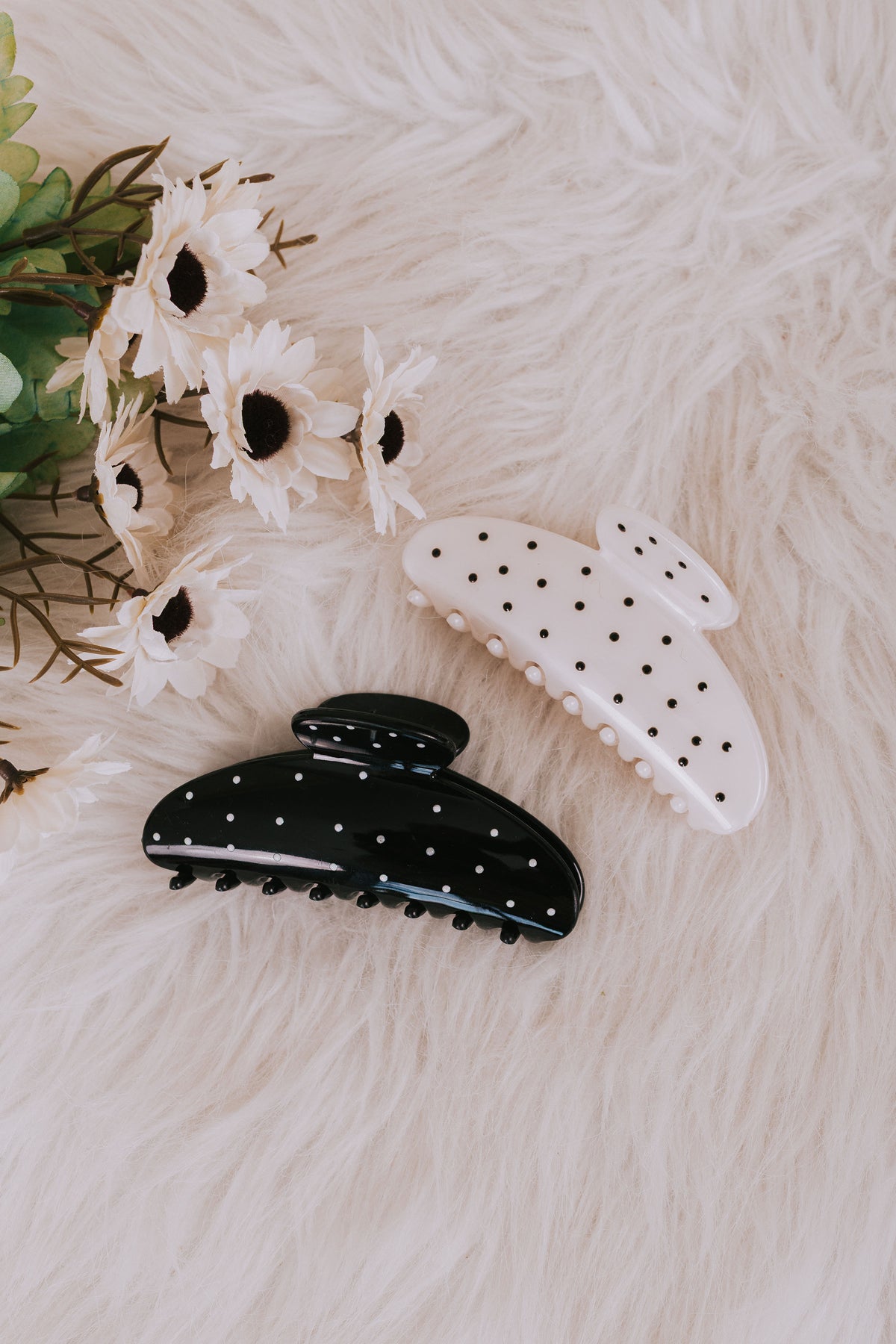 white and black claw clips with polka dots 