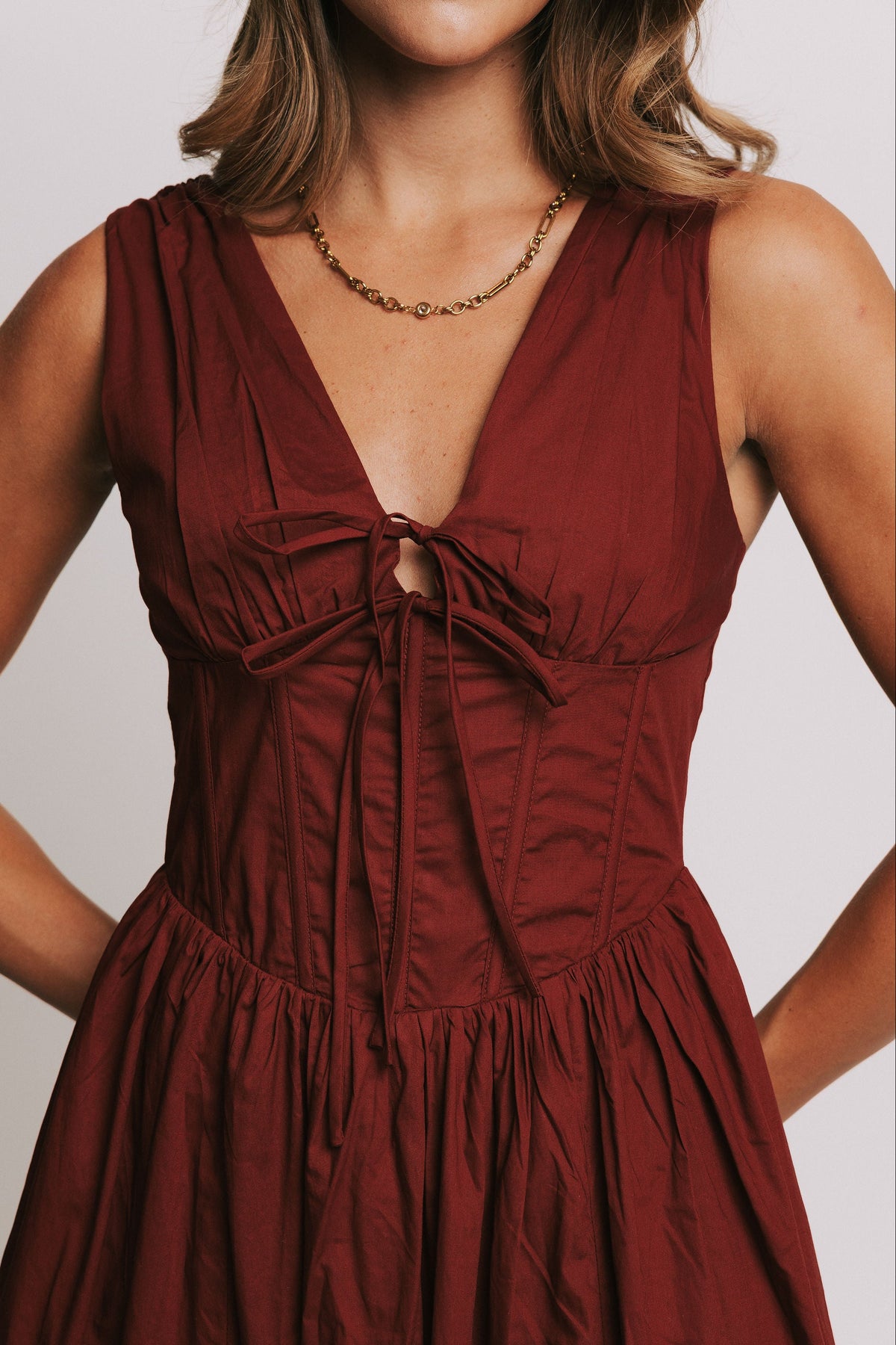 red midi dress with structured bodice close