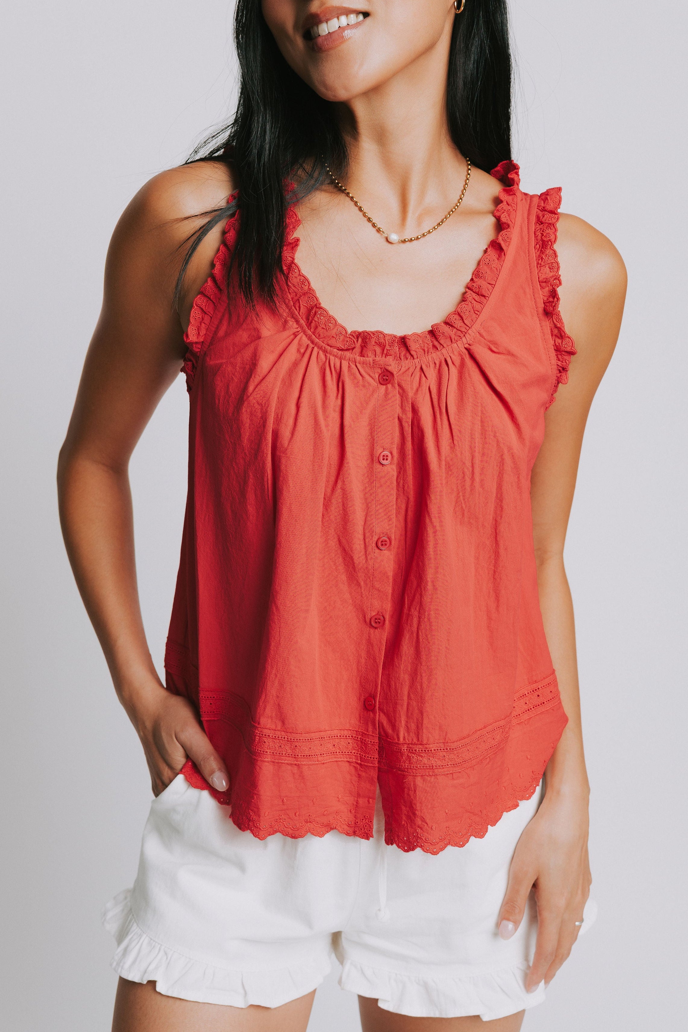red tank with ruffled trim and lace detail