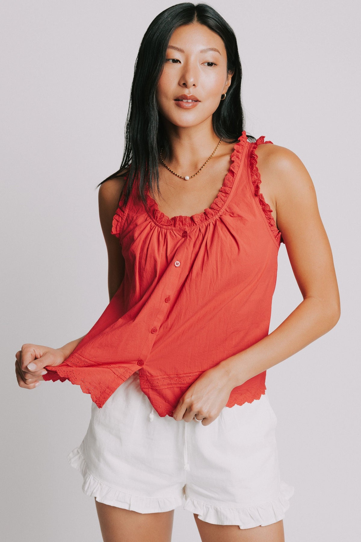red tank with ruffled trim and lace detail