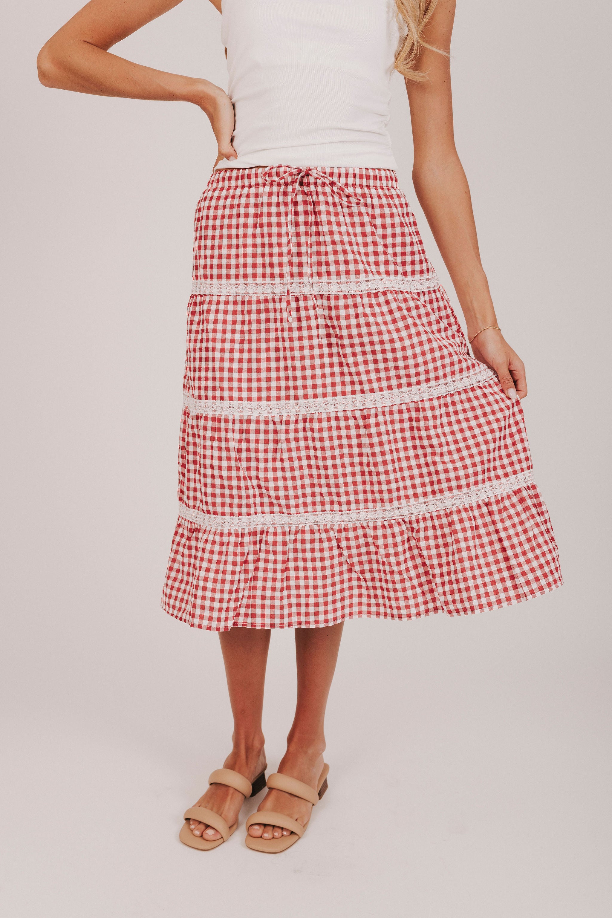 Red and white gingham midi skirt with lace trimmed tiers and a tied bow 