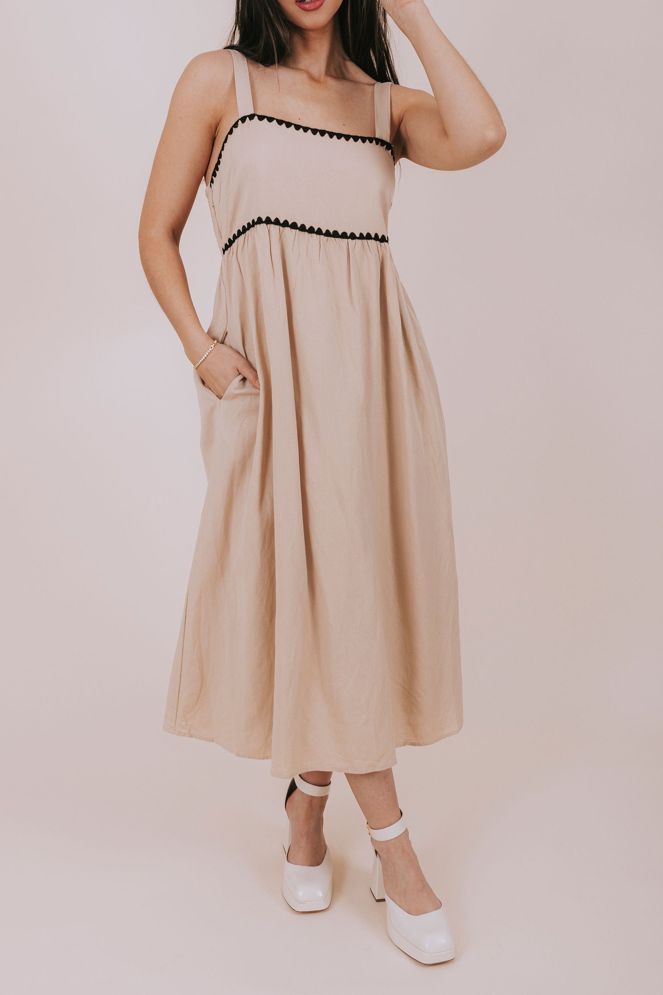 sand colored midi dress with black scallops front