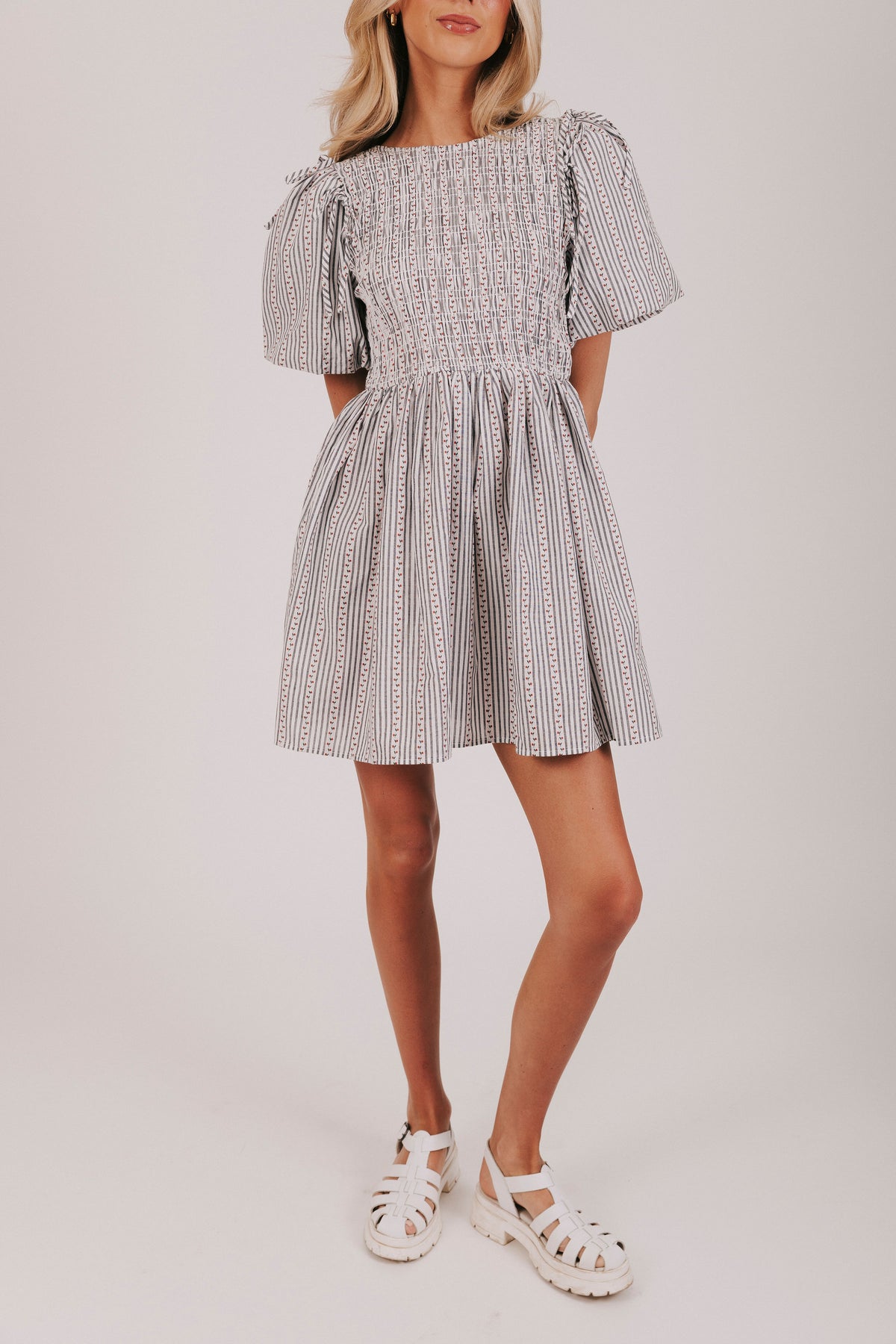 Vertically striped mini knee length dress with short puff sleeves 
