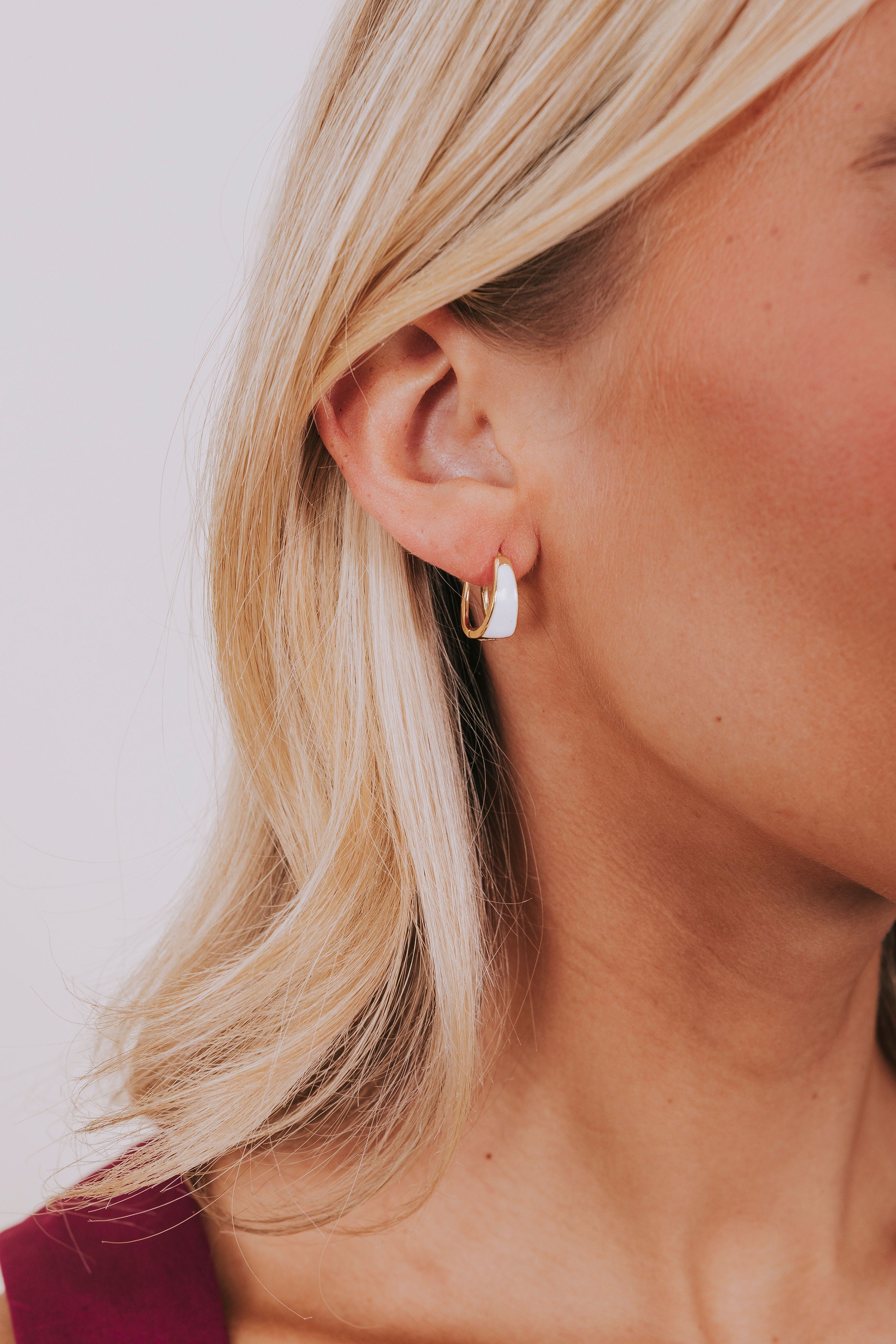 tapered white center huggie earring