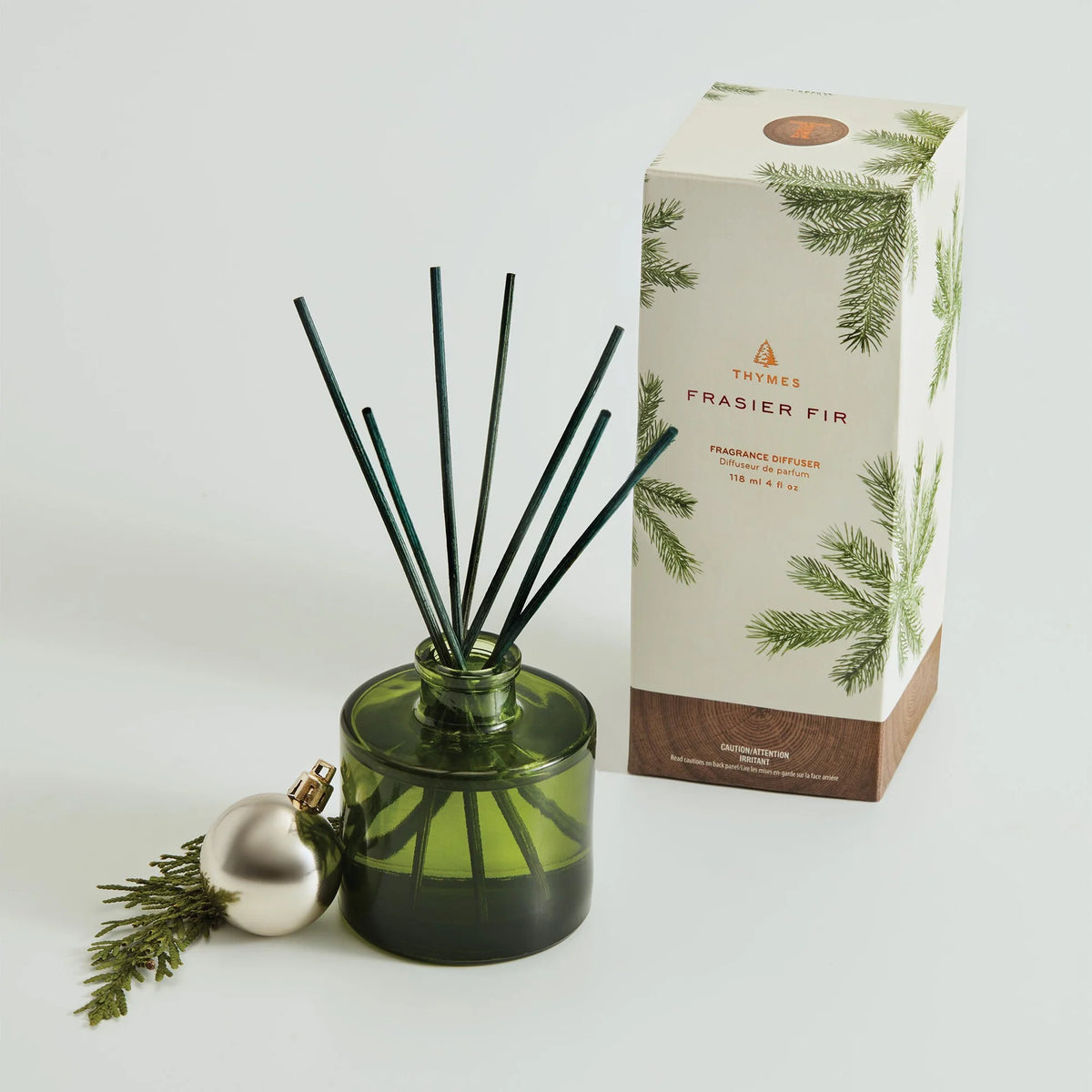 Thymes Frasier Fir diffuser with packaging on a white background