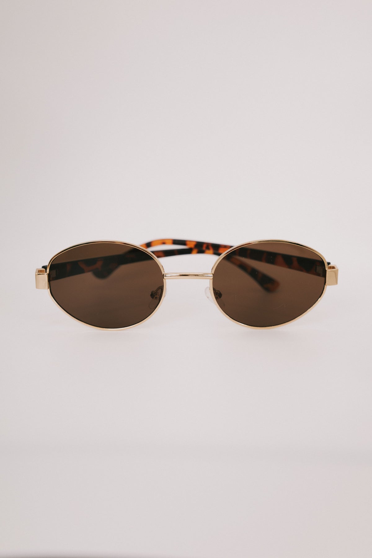 tortoiseshell gold rimmed sunglasses display