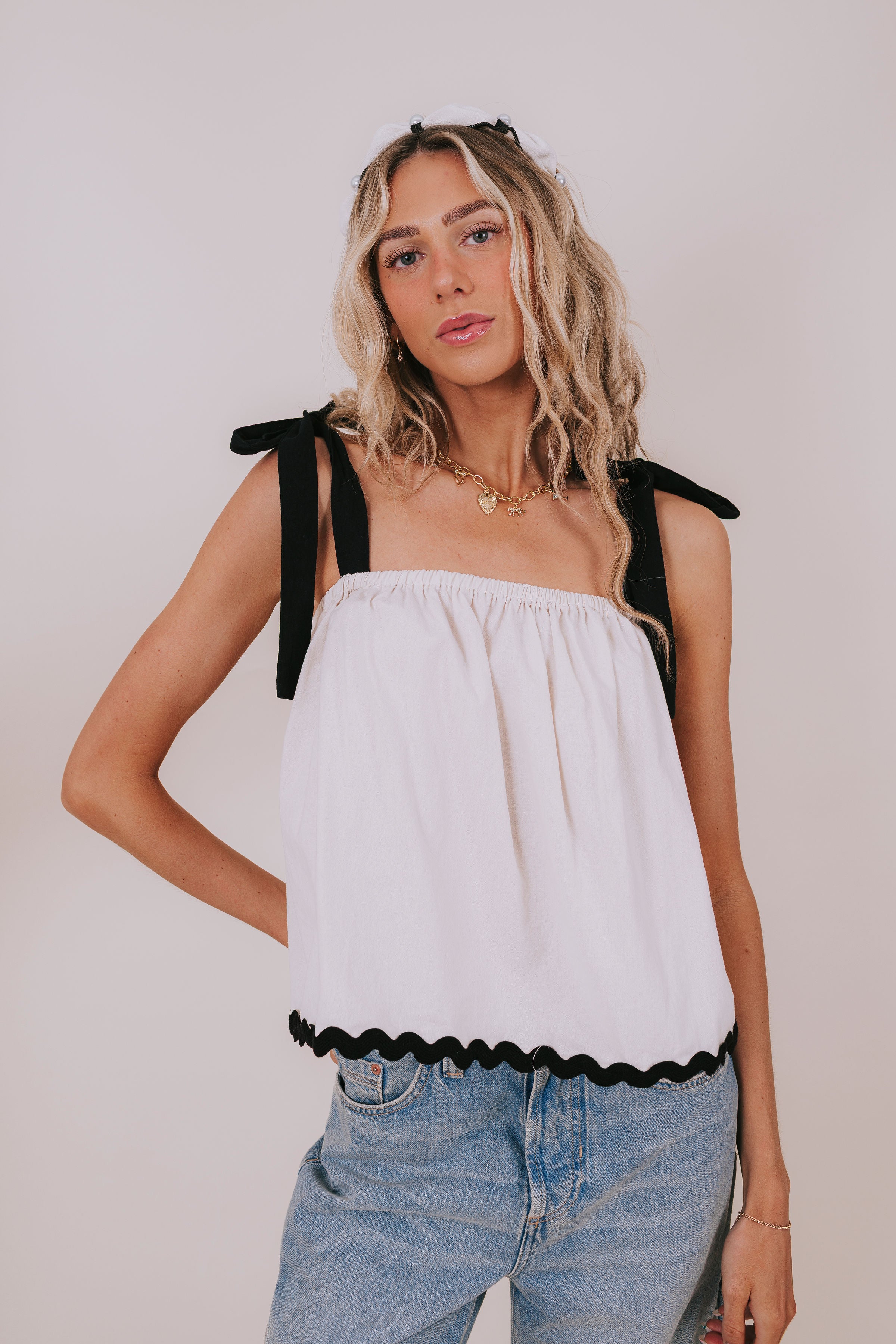 off-white and black bow strap blouse front