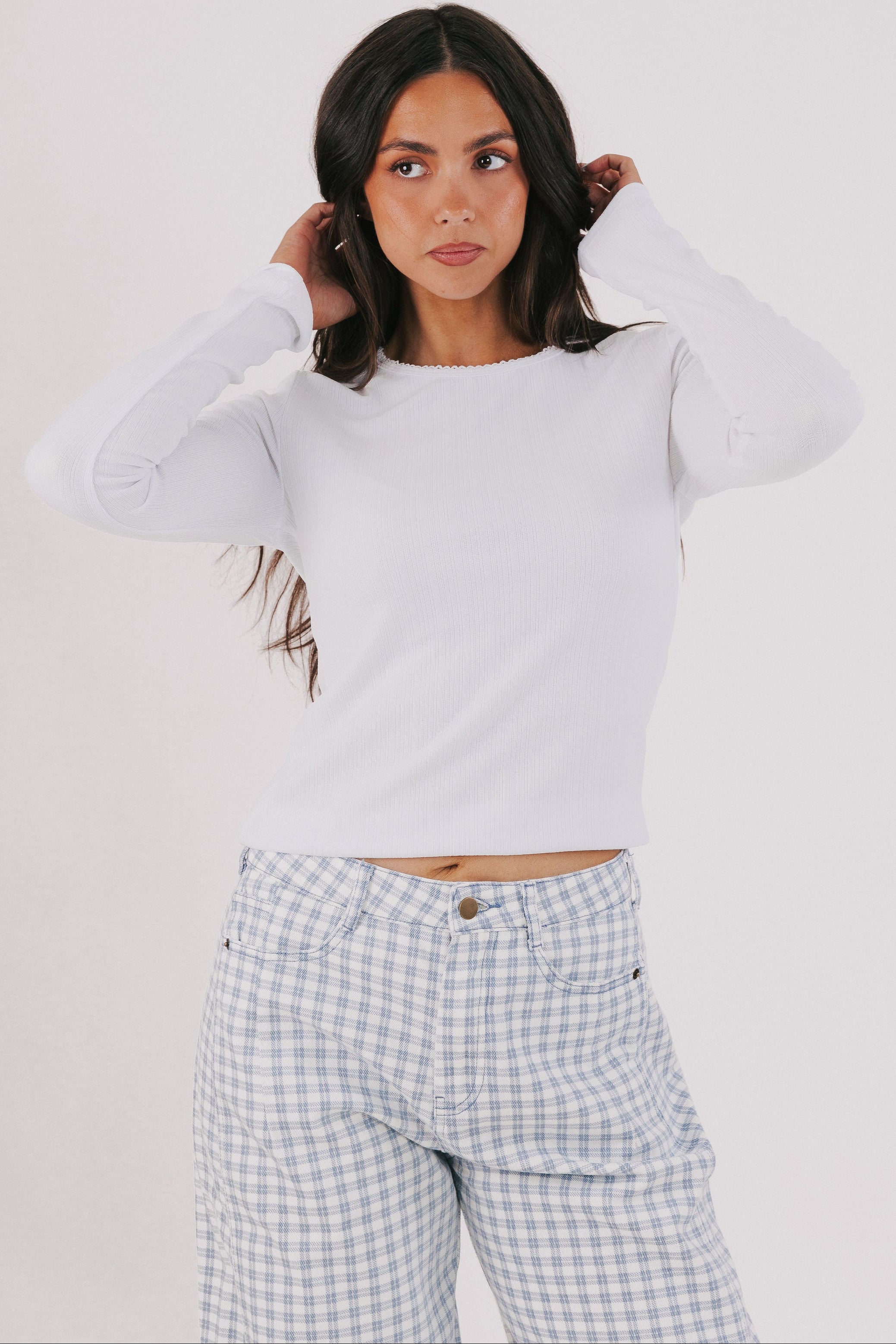white long sleeve top with trim detail