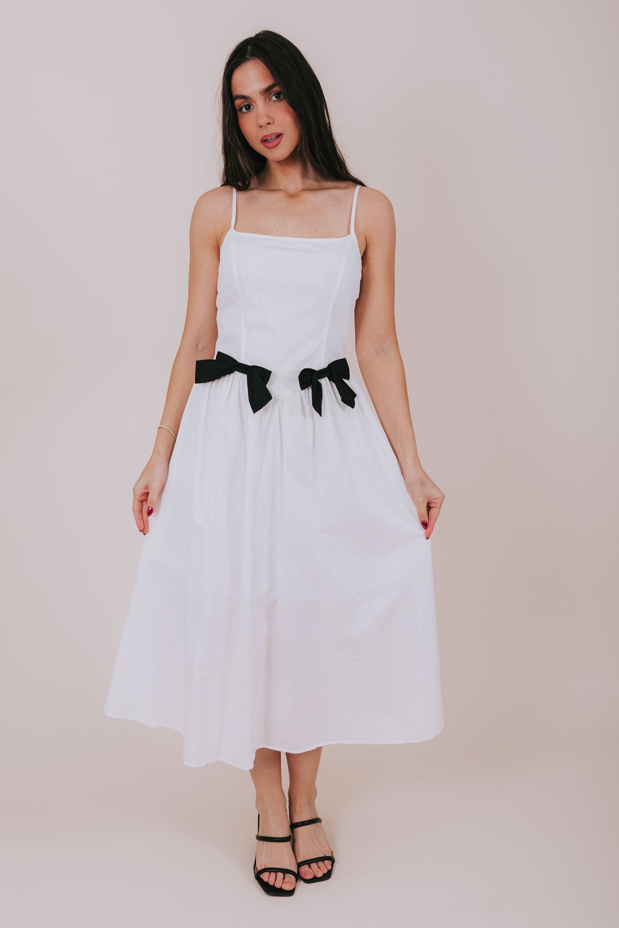 white midi dress with black bows front