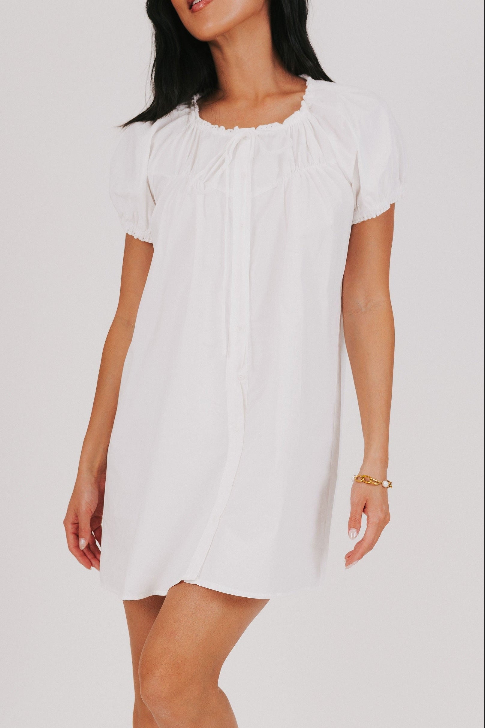 white mini dress with puff sleeves