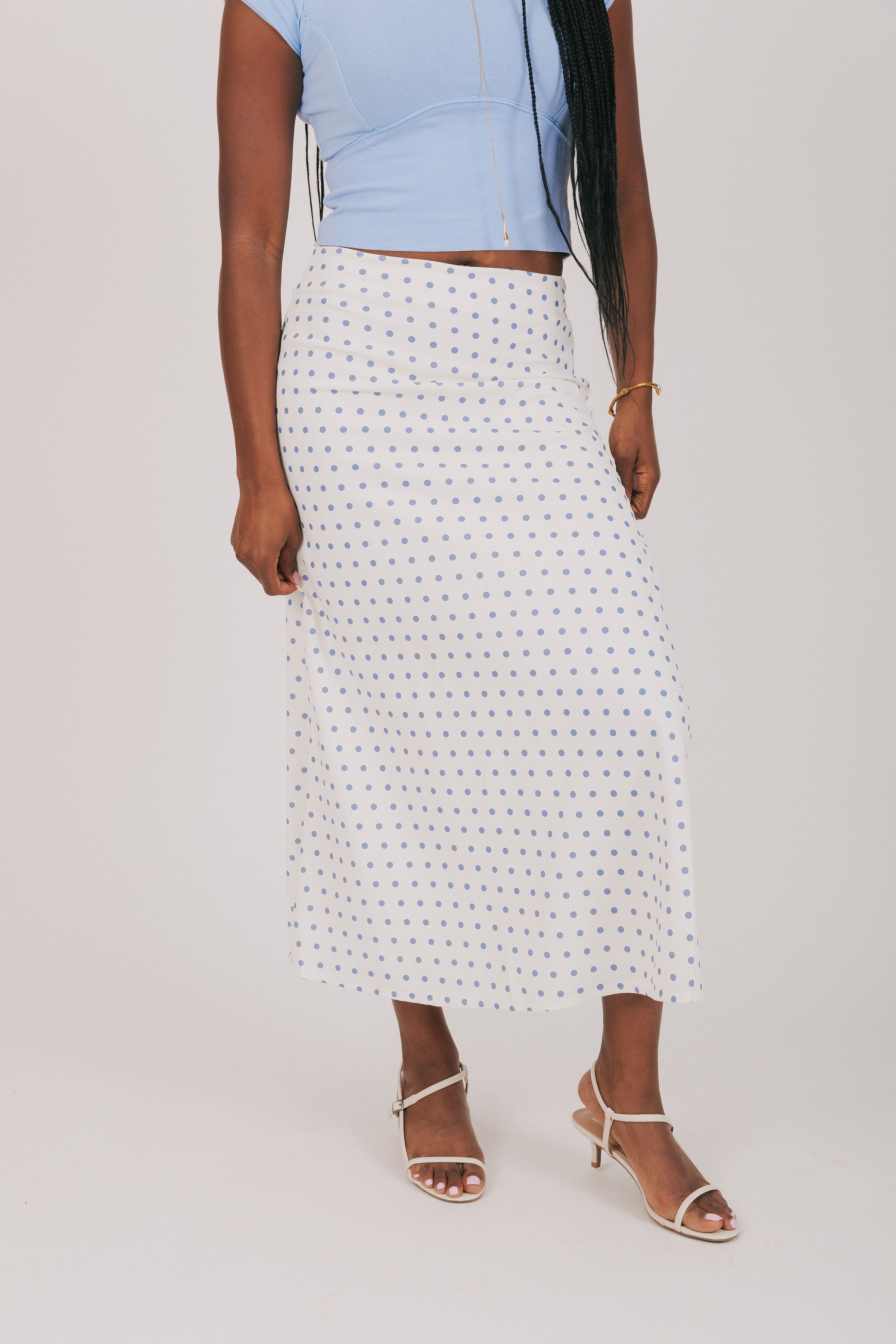 white skirt with blue polka dots 