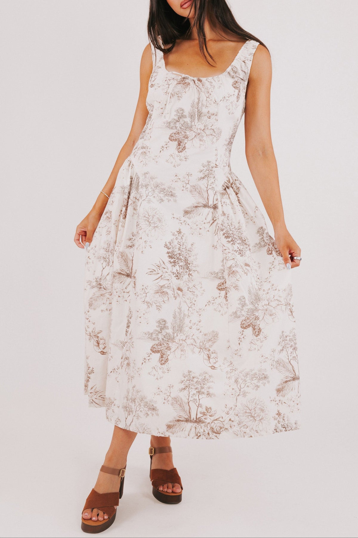 white sleeveless basque waist dress with brown floral print 
