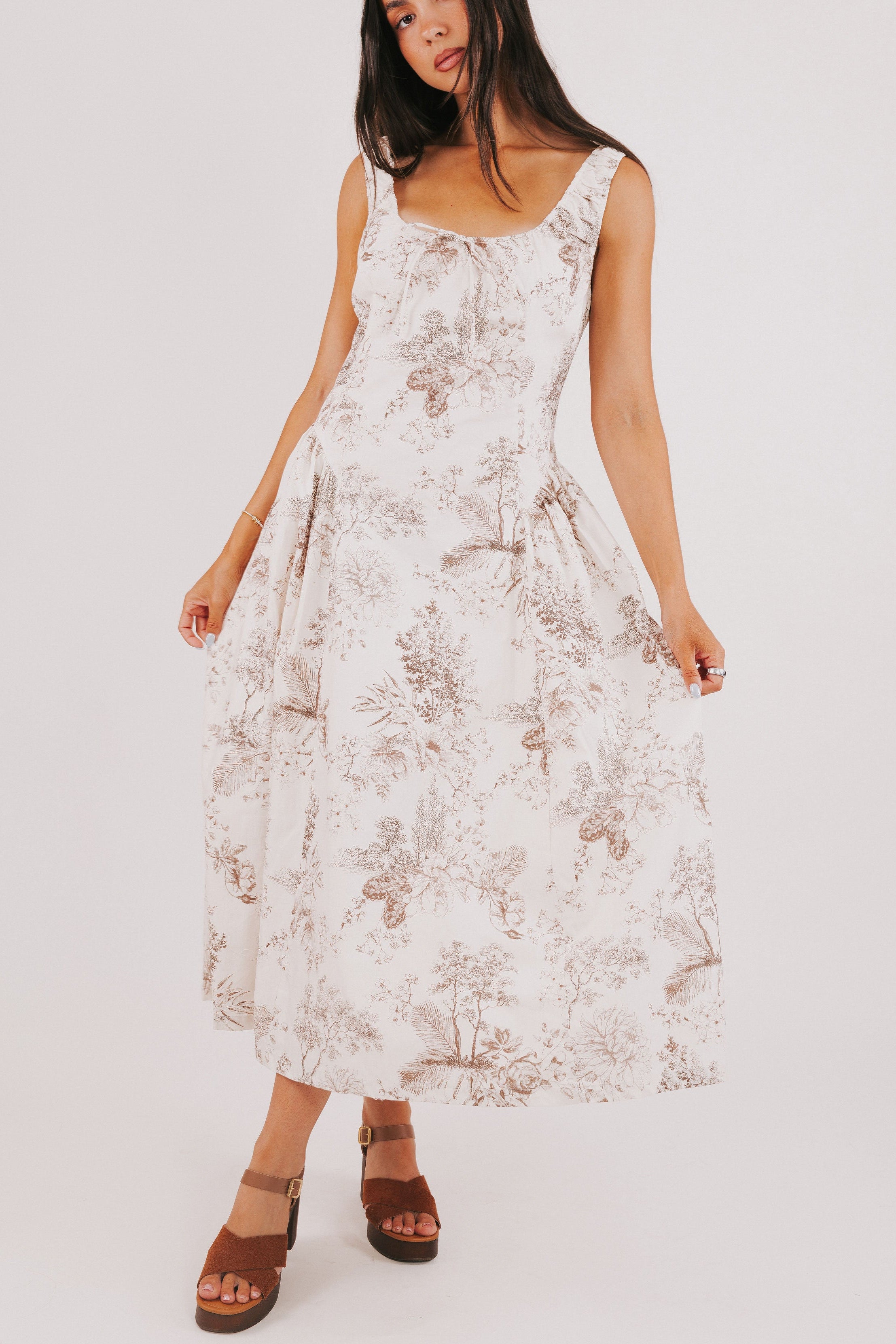 white sleeveless basque waist dress with brown floral print 