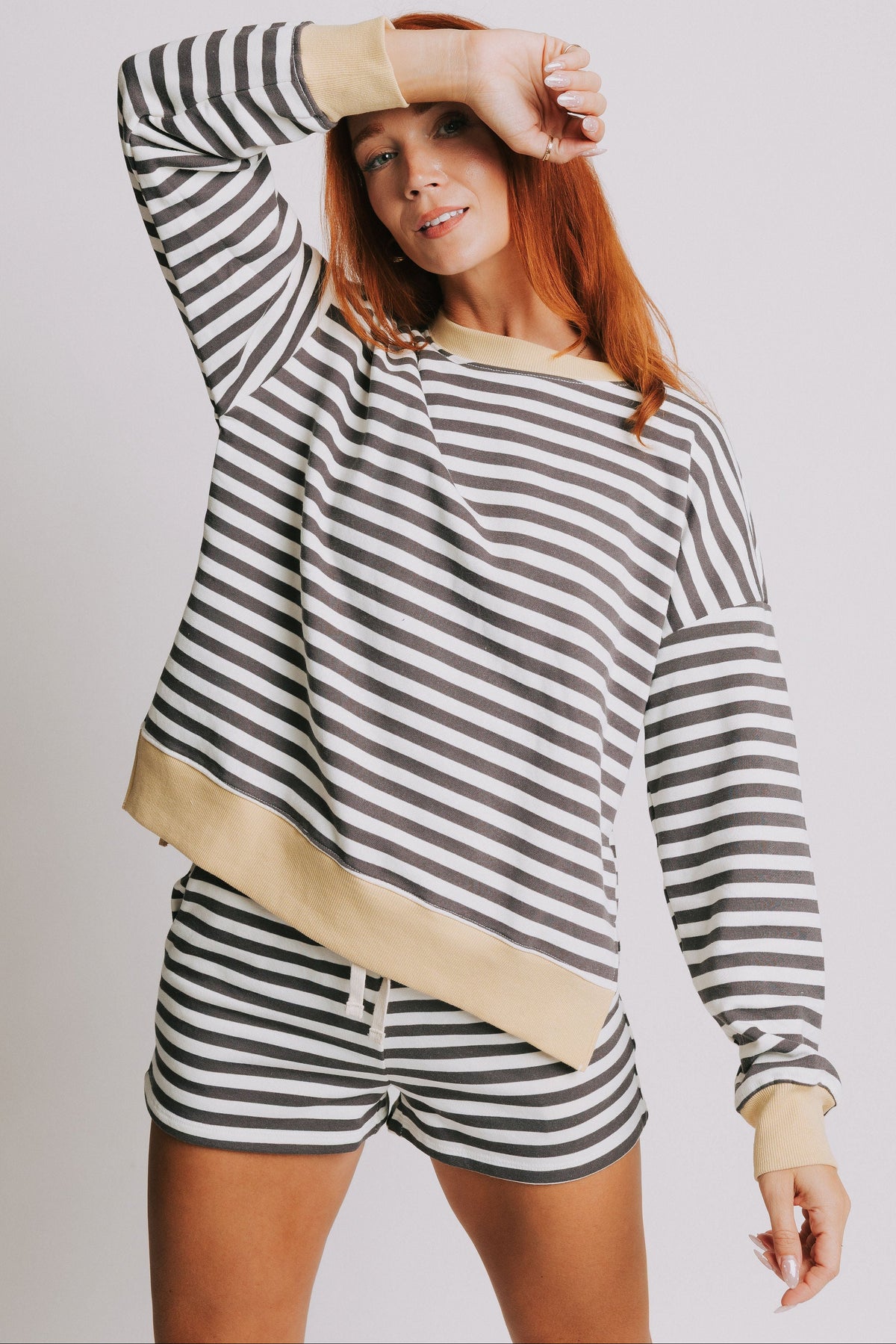 white striped long sleeve top with yellow trim 