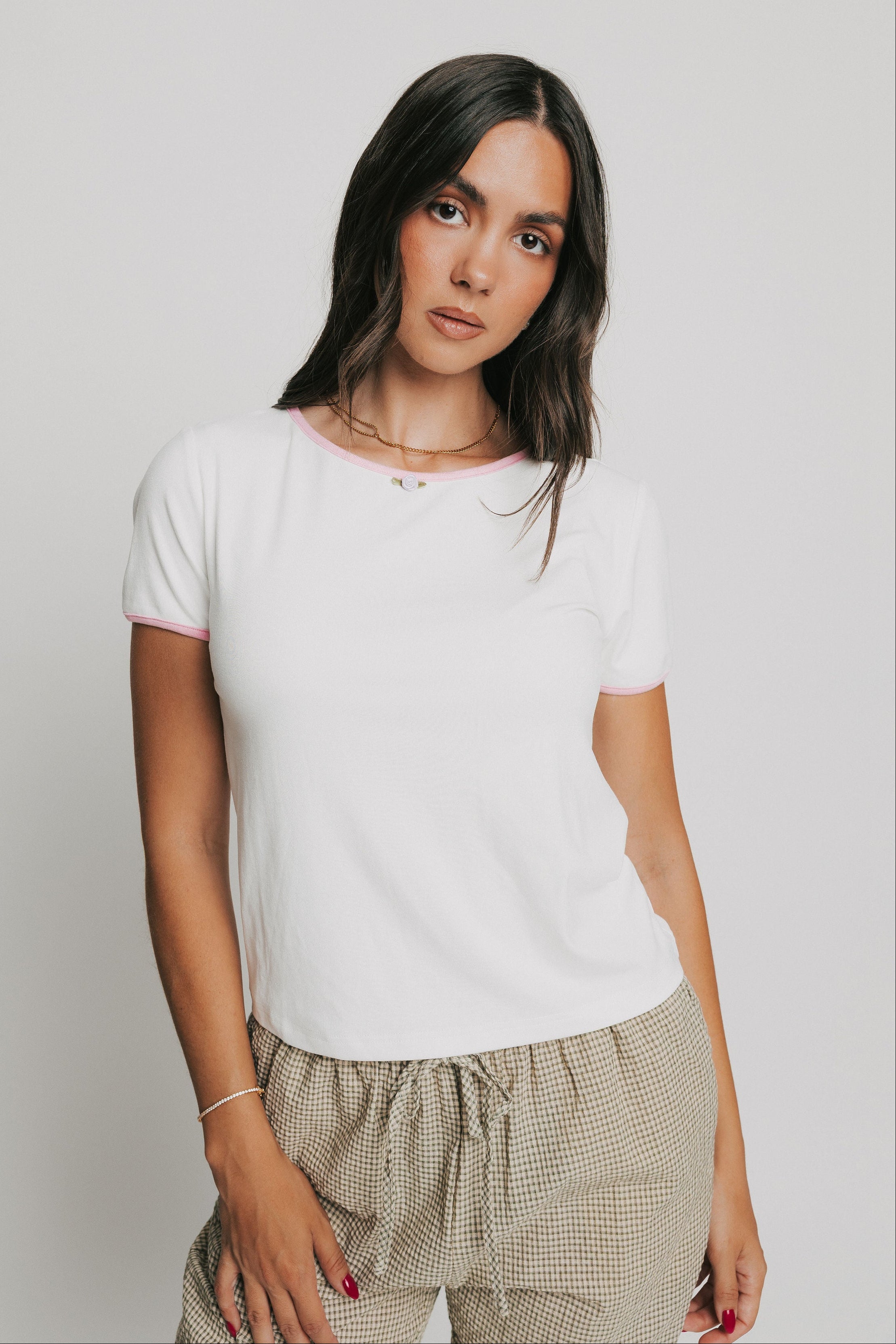 white tee with pink trim and rose applique