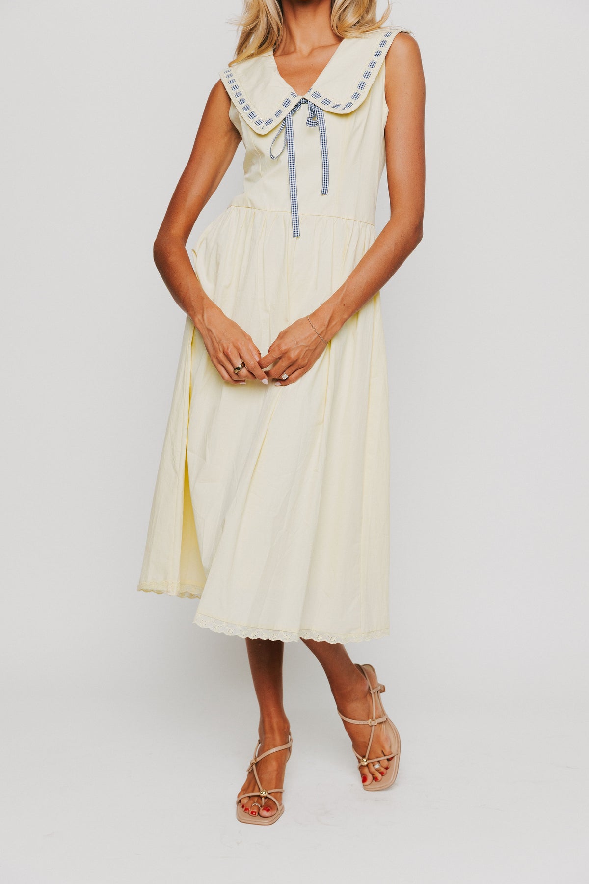 yellow midi dress with pan collar and blue ribbon detail
