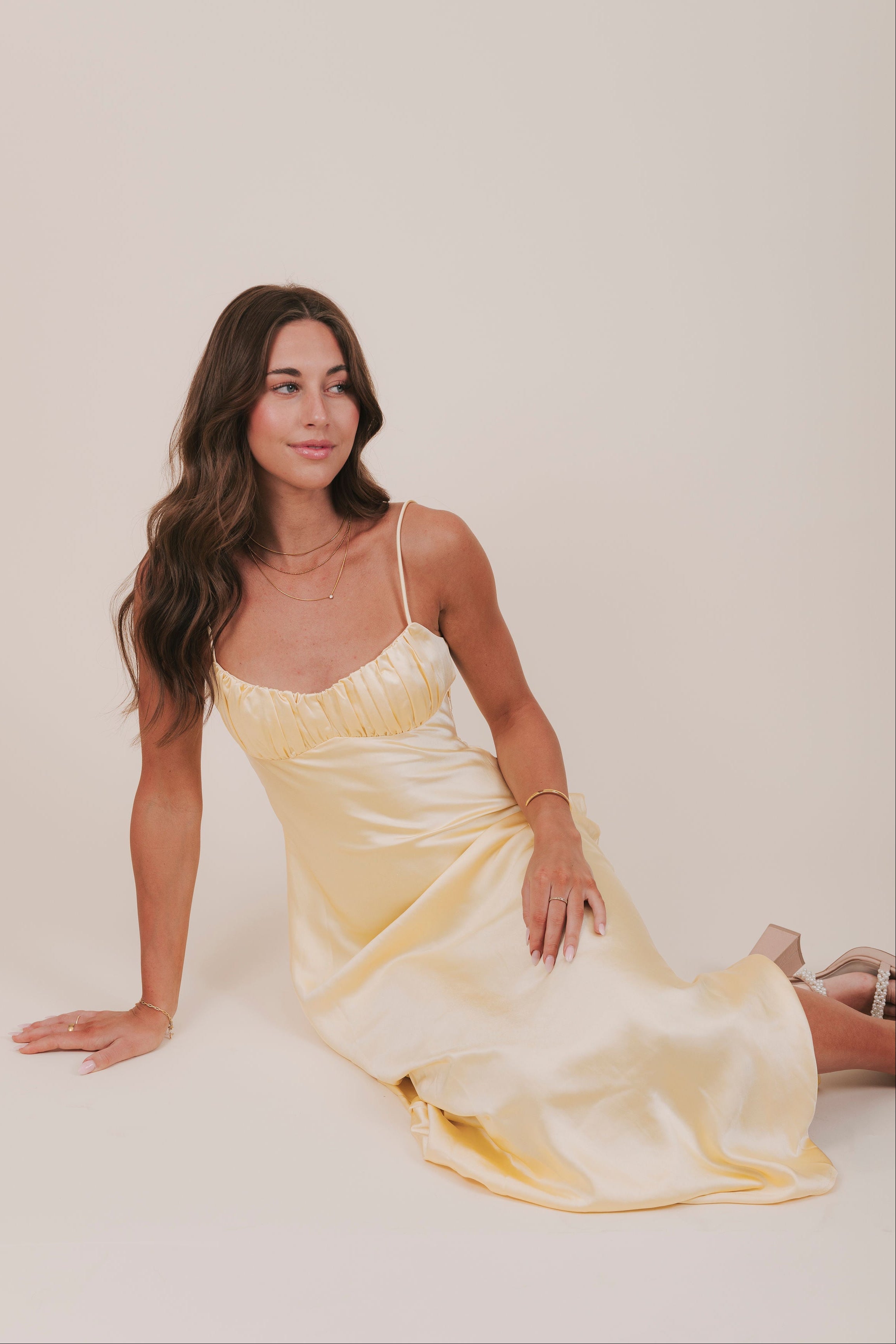 yellow satin sweetheart neckline maxi dress pose