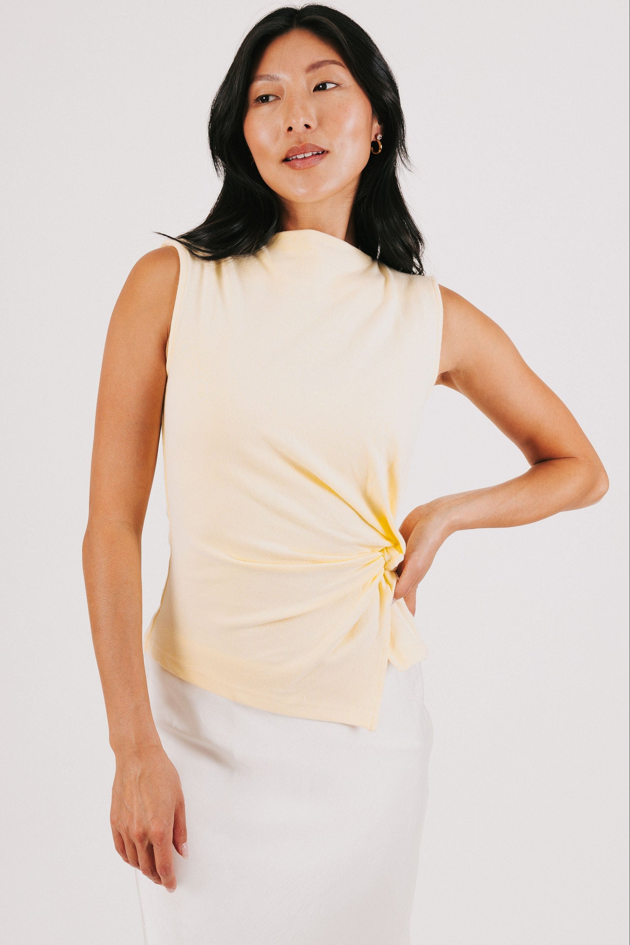 yellow sleeveless top with side twist