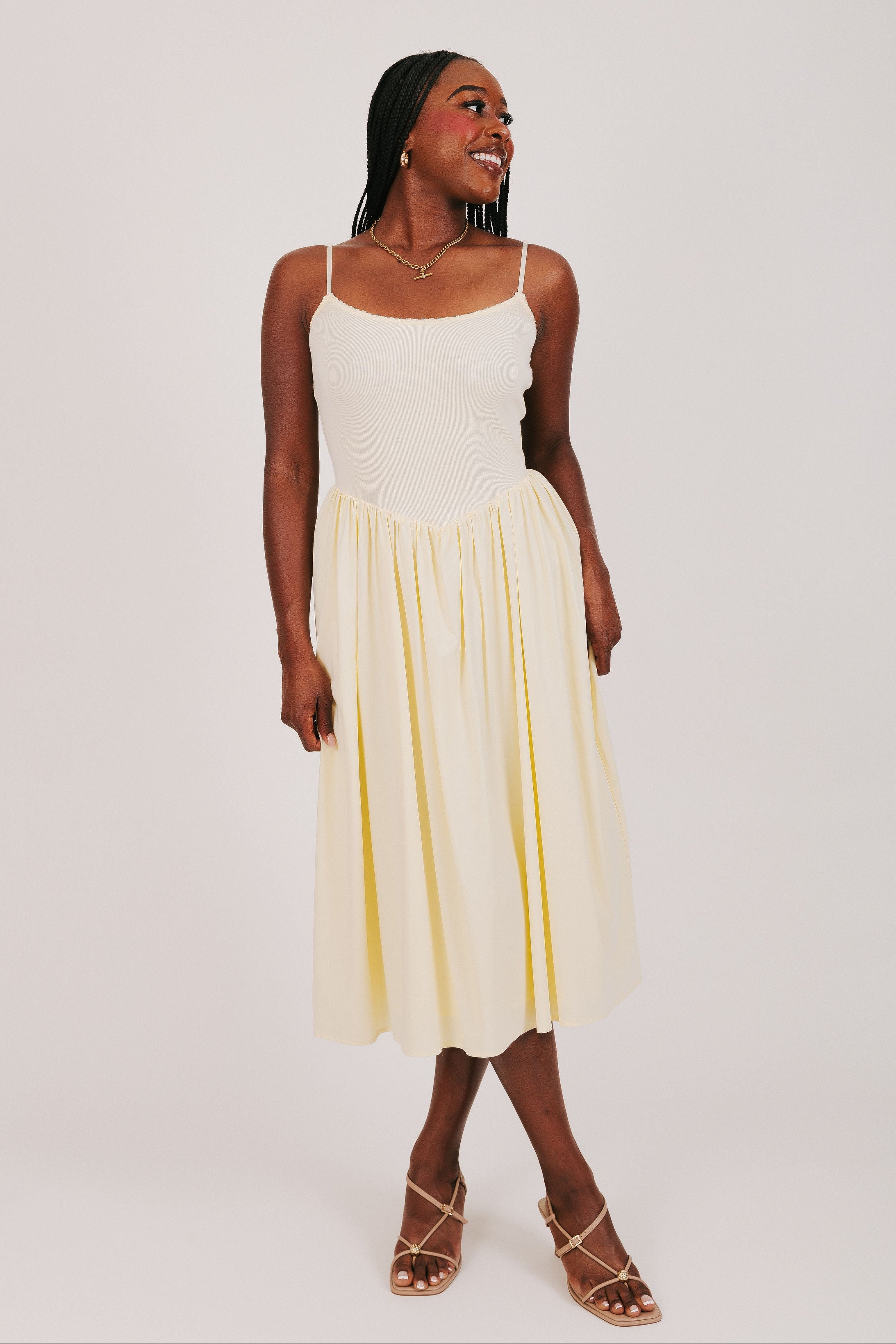 yellow spaghetti strap dress with flowy skirt